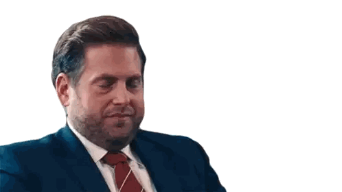 A Man In A Suit And Tie Is Sitting Down Sticker