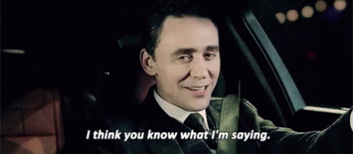 A Man In A Suit And Tie Is Sitting In A Car And Saying I Think You Know What I 'M Saying GIF