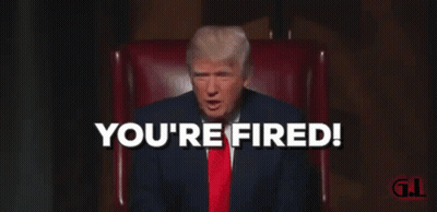 A Man In A Suit And Tie Is Sitting In A Chair And Says " You 'Re Fired " GIF