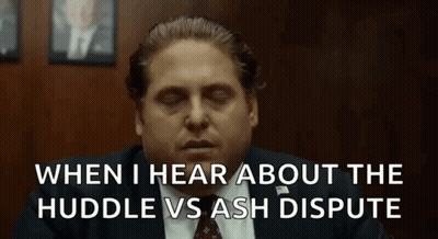 A Man In A Suit And Tie Is Sitting In A Room With His Eyes Closed And A Quote . GIF