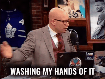 A Man In A Suit And Tie Is Sitting In Front Of A Laptop With The Words Washing My Hands Of It On It GIF