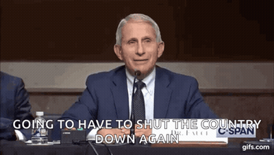A Man In A Suit And Tie Is Sitting In Front Of A Microphone And Saying Going To Have To Shut The Country Down Again . GIF