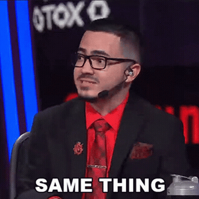 A Man In A Suit And Tie Is Sitting In Front Of A Microphone And Says Same Thing . GIF