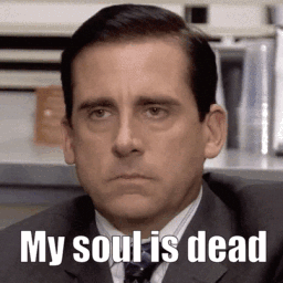 A Man In A Suit And Tie Is Sitting In Front Of A Sign That Says " My Soul Is Dead " GIF