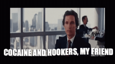A Man In A Suit And Tie Is Sitting In Front Of A Window And Says Cocaine And Hookers My Friend GIF