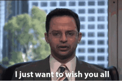A Man In A Suit And Tie Is Sitting In Front Of A Window And Says " I Just Want To Wish You All " GIF