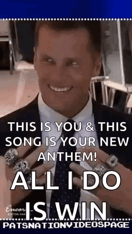 A Man In A Suit And Tie Is Smiling And Holding A Bunch Of Rings . GIF