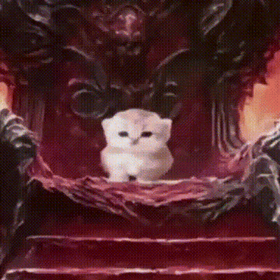 A Man In A Suit And Tie Is Smiling And Looking At The Camera GIF