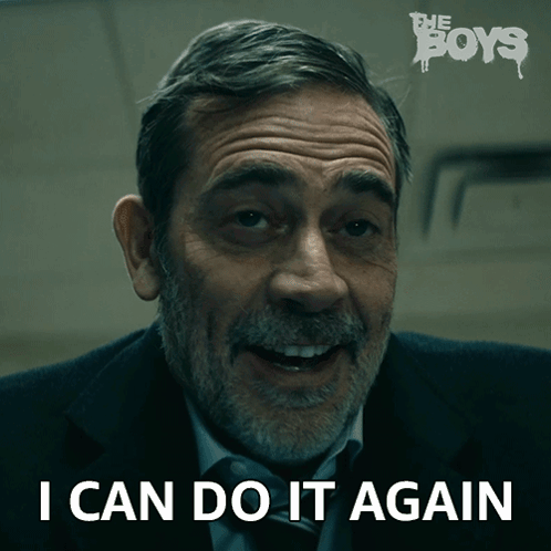 A Man In A Suit And Tie Is Smiling And Says I Can Do It Again GIF