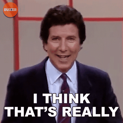 A Man In A Suit And Tie Is Smiling And Says I Think That 'S Really GIF