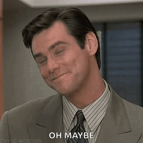A Man In A Suit And Tie Is Smiling And Says " Oh Maybe " GIF