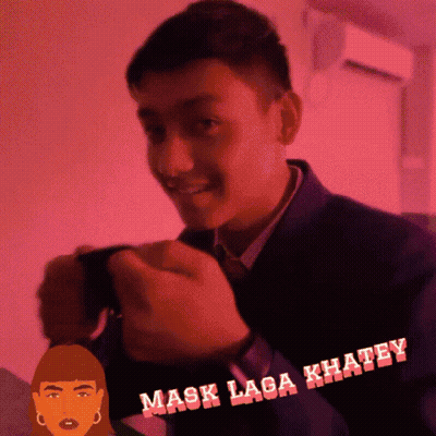 A Man In A Suit And Tie Is Smiling In Front Of A Pink Background That Says " Mask Laga Khaley " GIF
