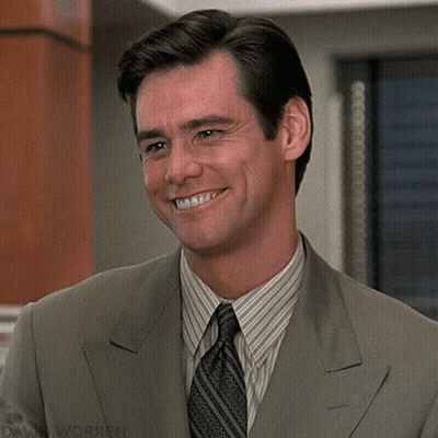 A Man In A Suit And Tie Is Smiling With David Worren Written On The Bottom Right GIF