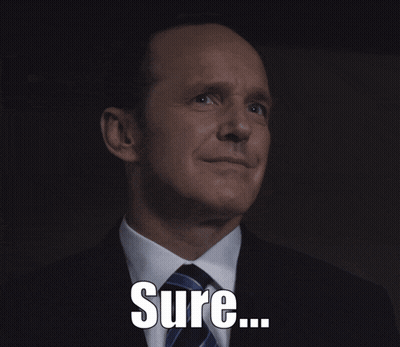a man in a suit and tie is smiling with the word sure below him