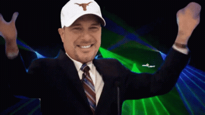 A Man In A Suit And Tie Is Smiling With The Words It 'S Hermaning Behind Him GIF