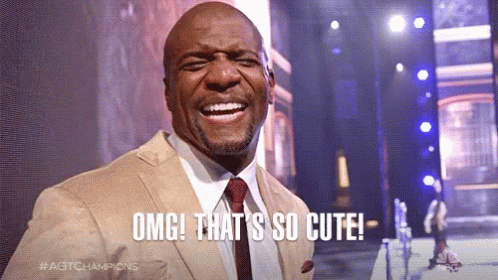 A Man In A Suit And Tie Is Smiling With The Words Omg That 'S So Cute GIF