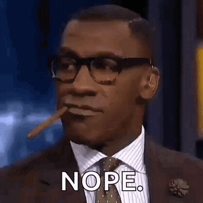 A Man In A Suit And Tie Is Smoking A Cigar In His Mouth . GIF