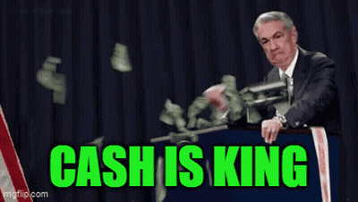 A Man In A Suit And Tie Is Standing At A Podium With Money Falling Around Him And The Words Cash Is King Written In Gree GIF