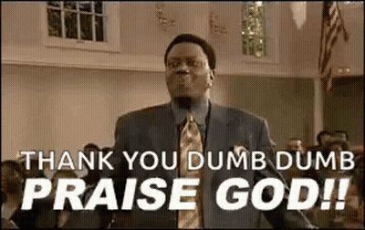 A Man In A Suit And Tie Is Standing In A Church And Saying `` Thank You Dumb Dumb Praise God '' . GIF