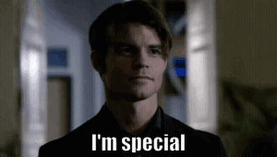 A Man In A Suit And Tie Is Standing In A Hallway And Saying `` I 'M Special '' . GIF