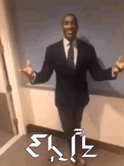 A Man In A Suit And Tie Is Standing In A Hallway With His Arms Outstretched And The Word Exit Written In White Letters GIF