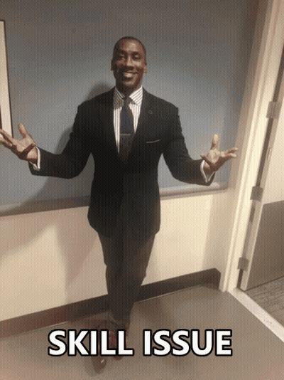 A Man In A Suit And Tie Is Standing In A Hallway With The Words Skill Issue Written Below Him GIF