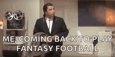 A Man In A Suit And Tie Is Standing In A Living Room And Says `` Me , Coming Back To Play Fantasy Football `` . GIF