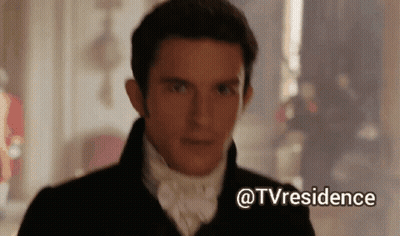 A Man In A Suit And Tie Is Standing In A Room With A Caption That Says Tvresidence GIF