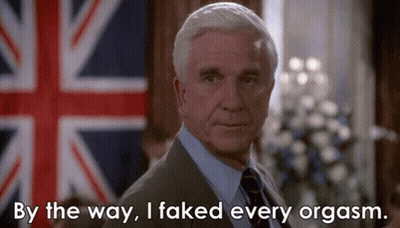 A Man In A Suit And Tie Is Standing In Front Of A British Flag And Says By The Way I Faked Every Orgasm . GIF