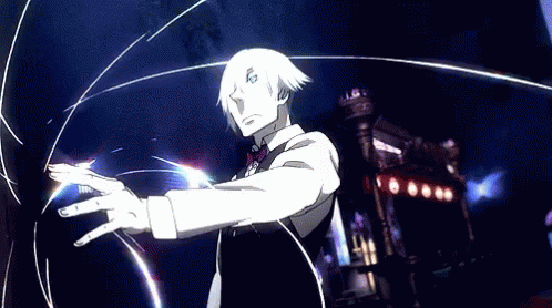 A Man In A Suit And Tie Is Standing In Front Of A Building . GIF