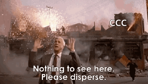 A Man In A Suit And Tie Is Standing In Front Of A Building That Is On Fire And Says Nothing To See Here Please Disperse GIF