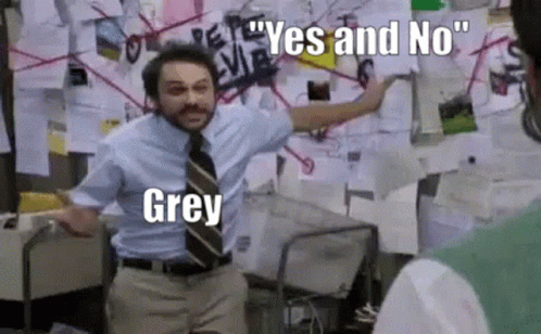 A Man In A Suit And Tie Is Standing In Front Of A Bulletin Board With Papers On It . GIF