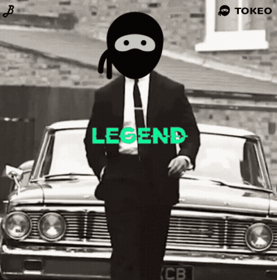 A Man In A Suit And Tie Is Standing In Front Of A Car With The Word Legend Written On It GIF