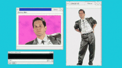 A Man In A Suit And Tie Is Standing In Front Of A Computer Screen GIF