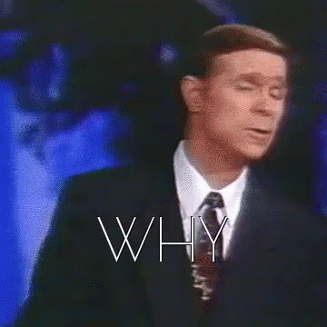 A Man In A Suit And Tie Is Standing In Front Of A Cross With The Words Why Written Above Him GIF