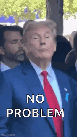 A Man In A Suit And Tie Is Standing In Front Of A Crowd . GIF