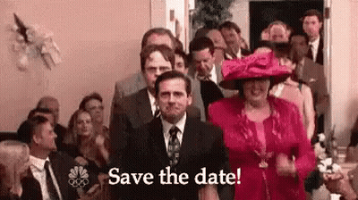 A Man In A Suit And Tie Is Standing In Front Of A Crowd Of People With The Words `` Save The Date '' . GIF