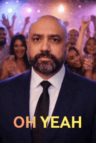 A Man In A Suit And Tie Is Standing In Front Of A Crowd With The Words Oh Yeah Above Him GIF