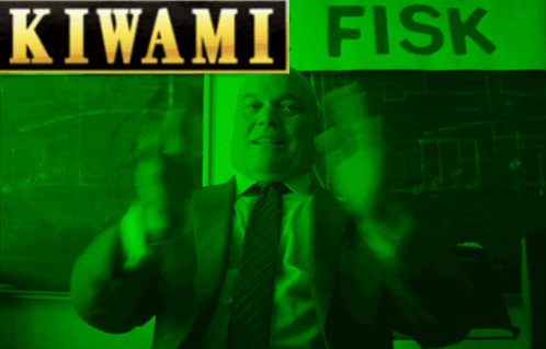 A Man In A Suit And Tie Is Standing In Front Of A Green Sign That Says Kiwami Fisk GIF