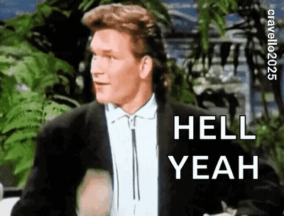 A Man In A Suit And Tie Is Standing In Front Of A Palm Tree And Saying `` Hell Yeah '' . GIF