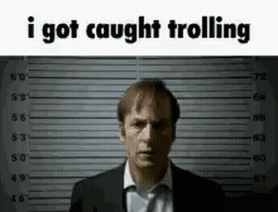 A Man In A Suit And Tie Is Standing In Front Of A Police Lineup And Says `` I Got Caught Trolling '' . GIF