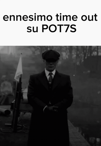 A Man In A Suit And Tie Is Standing In Front Of A Sign That Says " Ennesimo Time Out Su Pot7s " GIF