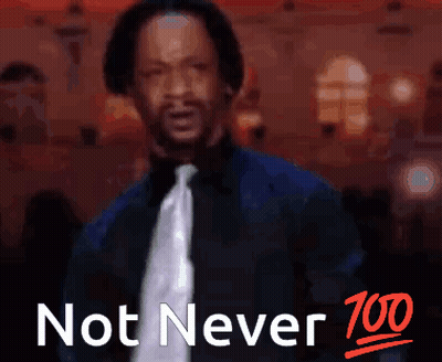 A Man In A Suit And Tie Is Standing In Front Of A Sign That Says Not Never GIF
