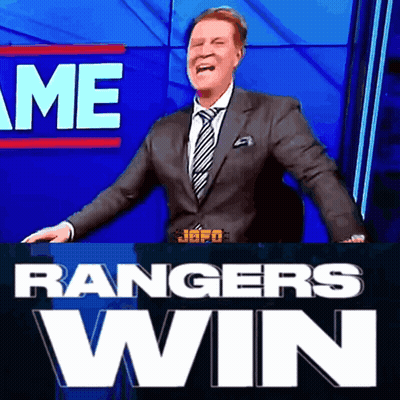 A Man In A Suit And Tie Is Standing In Front Of A Sign That Says " Rangers Win " GIF