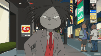 A Man In A Suit And Tie Is Standing In Front Of A Sign That Says Yoko GIF