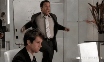 A Man In A Suit And Tie Is Standing In Front Of A White Board That Says " Got This " GIF