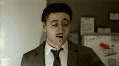 A Man In A Suit And Tie Is Standing In Front Of A Whiteboard That Says Sage 83 GIF