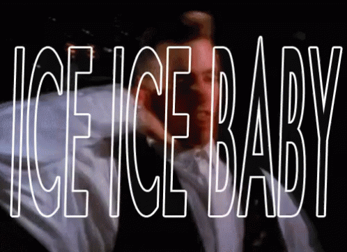 A Man In A Suit And Tie Is Standing In Front Of The Words Ice Ice Baby GIF