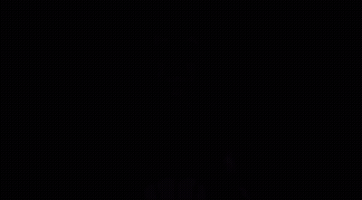 A Man In A Suit And Tie Is Standing In The Dark With His Mouth Open And The Words `` No '' Coming Out Of His Mouth . GIF