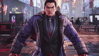 A Man In A Suit And Tie Is Standing In The Middle Of A City Street . GIF